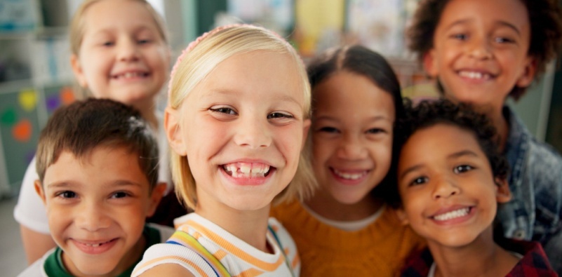 A close up of a group of mixed ethnicity children.