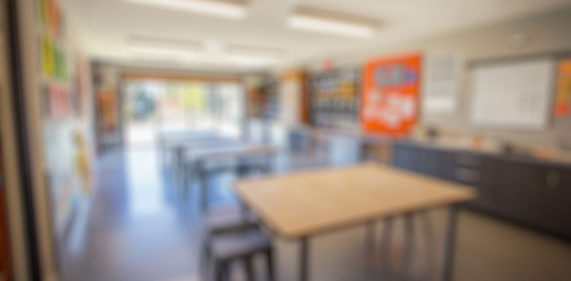 Blurred view of a school classroom, illustrating how unclear vision can affect what a child sees.